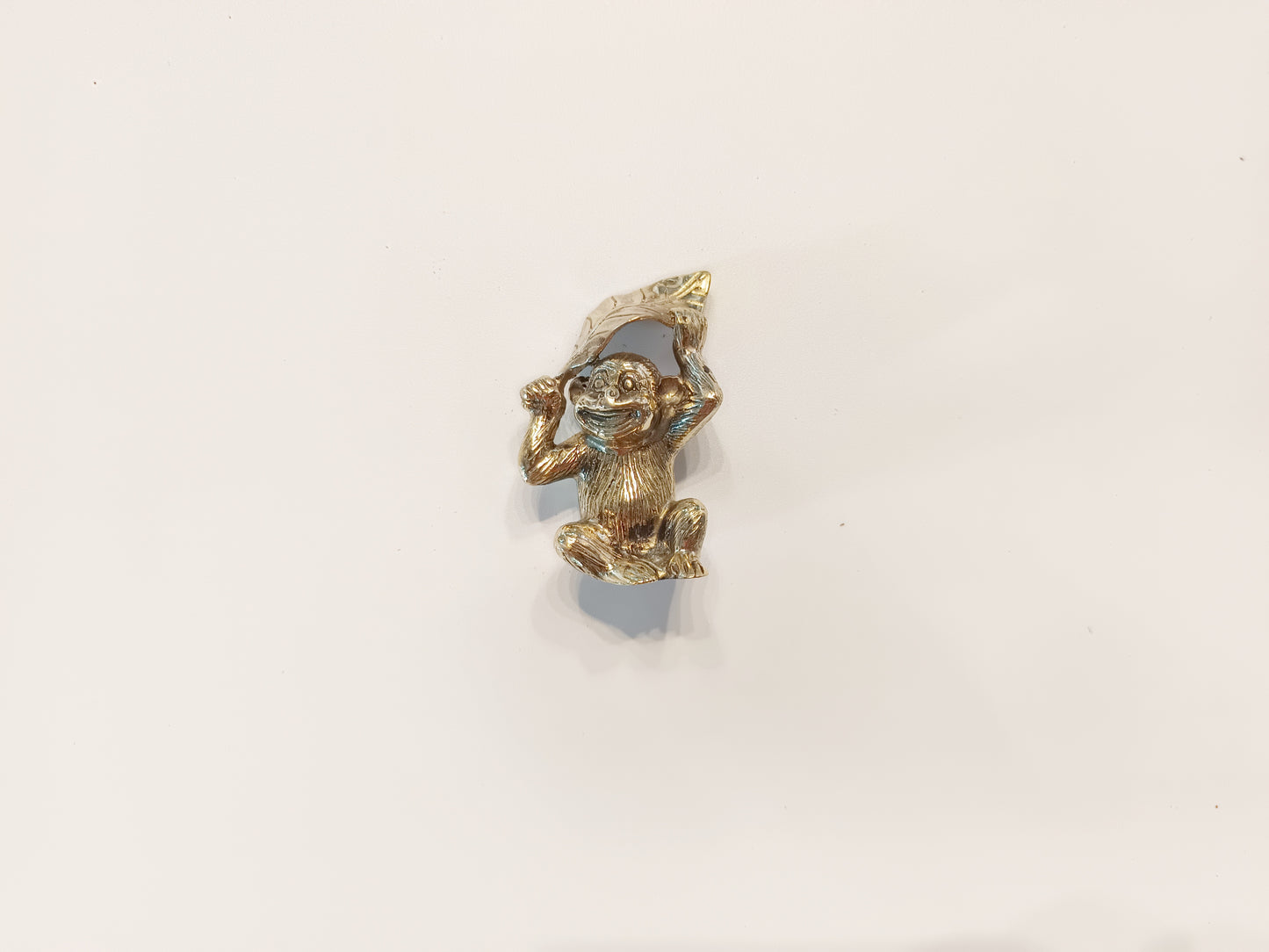 Monkey brass figurine, antique brass ape with leaf miniature
