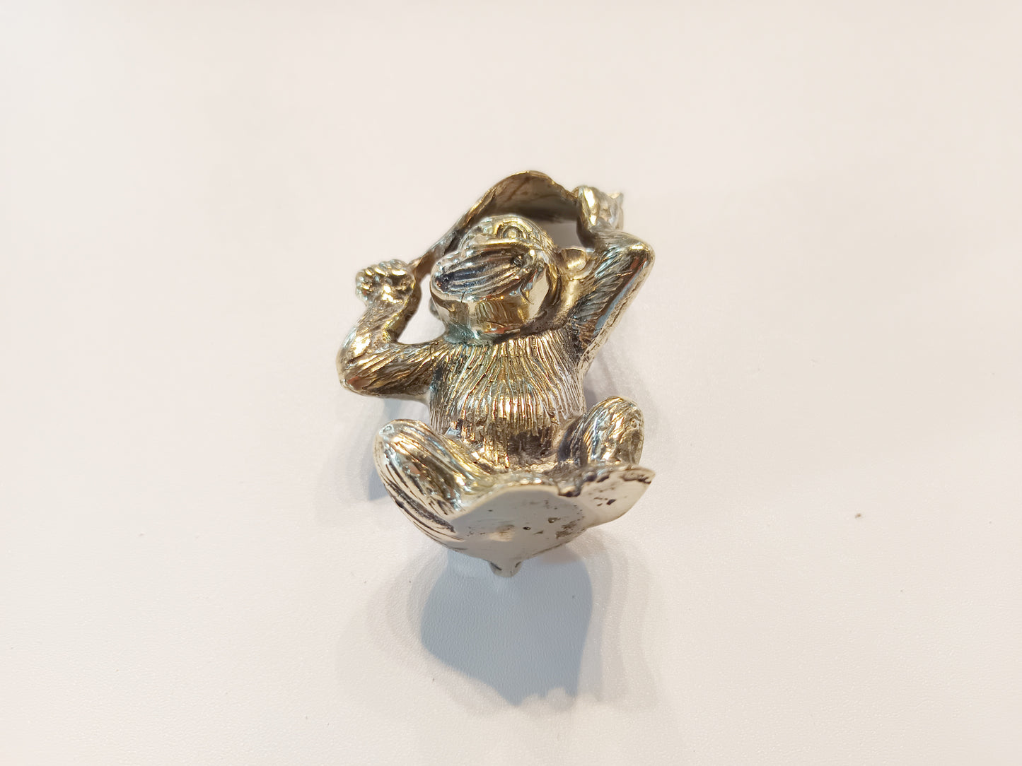 Monkey brass figurine, antique brass ape with leaf miniature