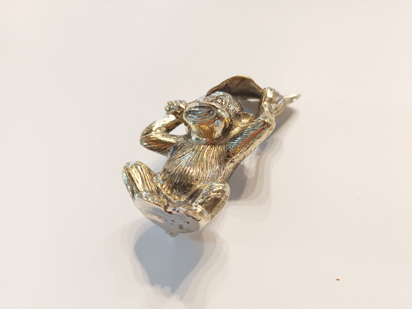 Monkey brass figurine, antique brass ape with leaf miniature