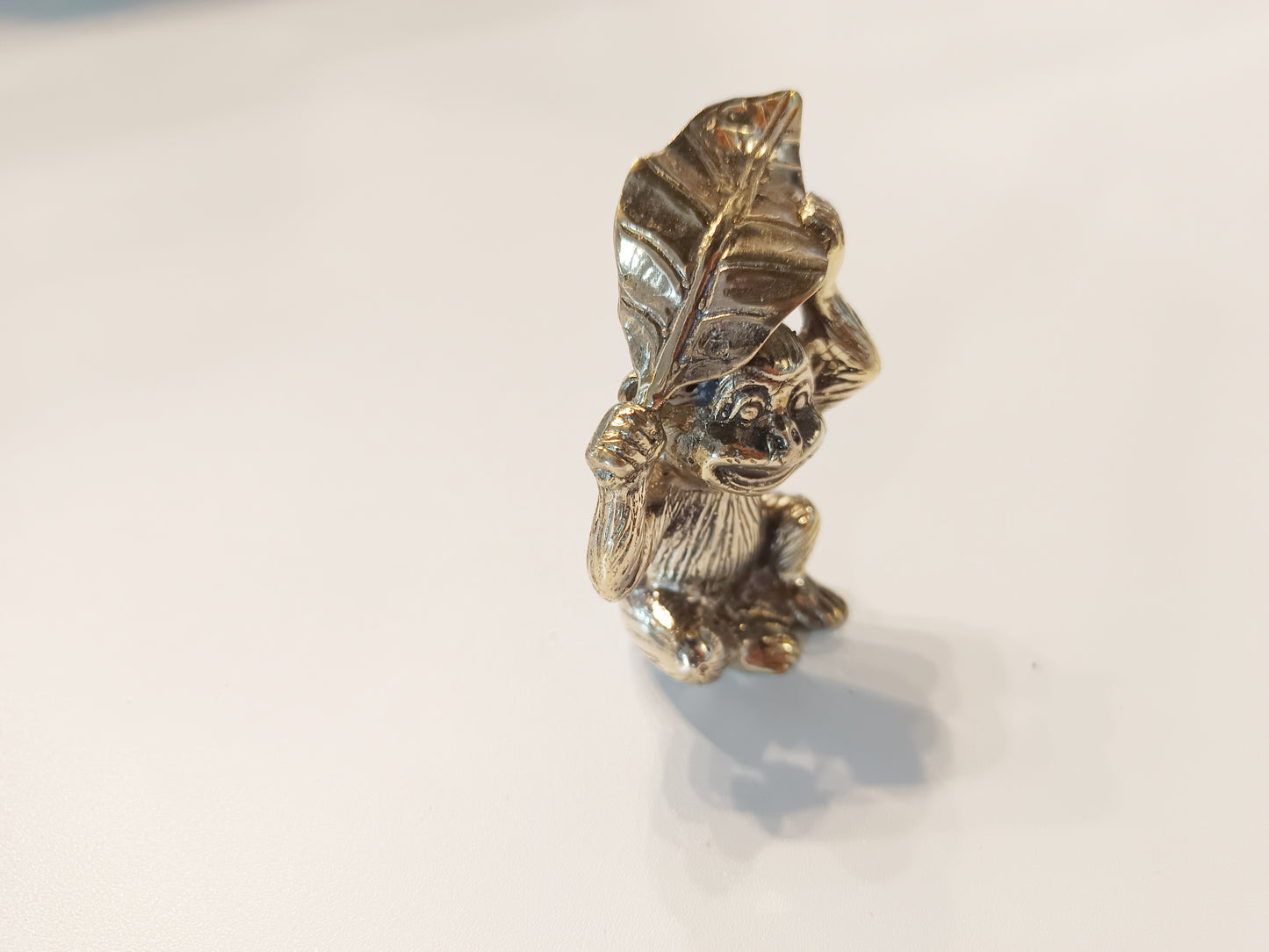Monkey brass figurine, antique brass ape with leaf miniature