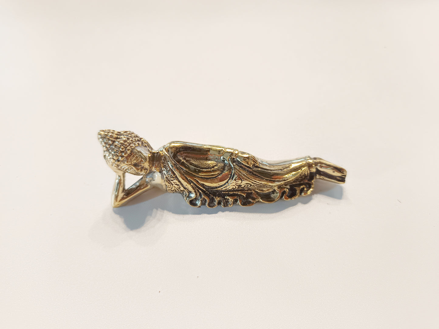 Sleeping Buddha brass figurine, antique brass relaxing Buddha miniature.