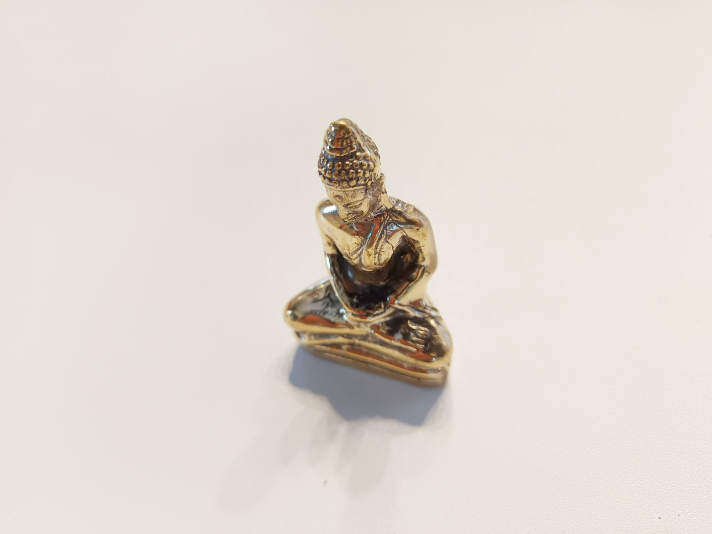 Meditating Buddha brass figurine, antique brass praying Buddha miniature.