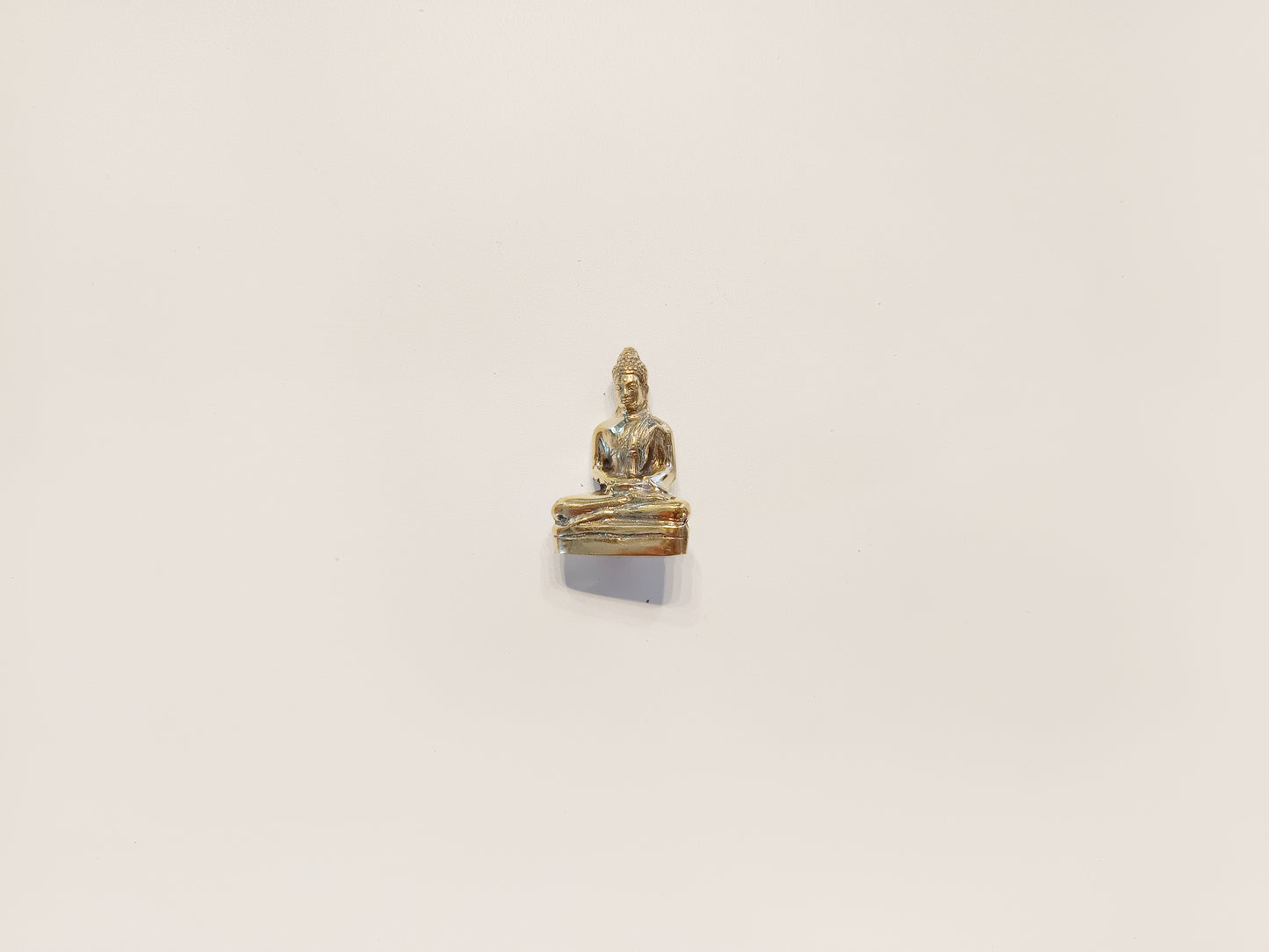 Meditating Buddha brass figurine, antique brass praying Buddha miniature.