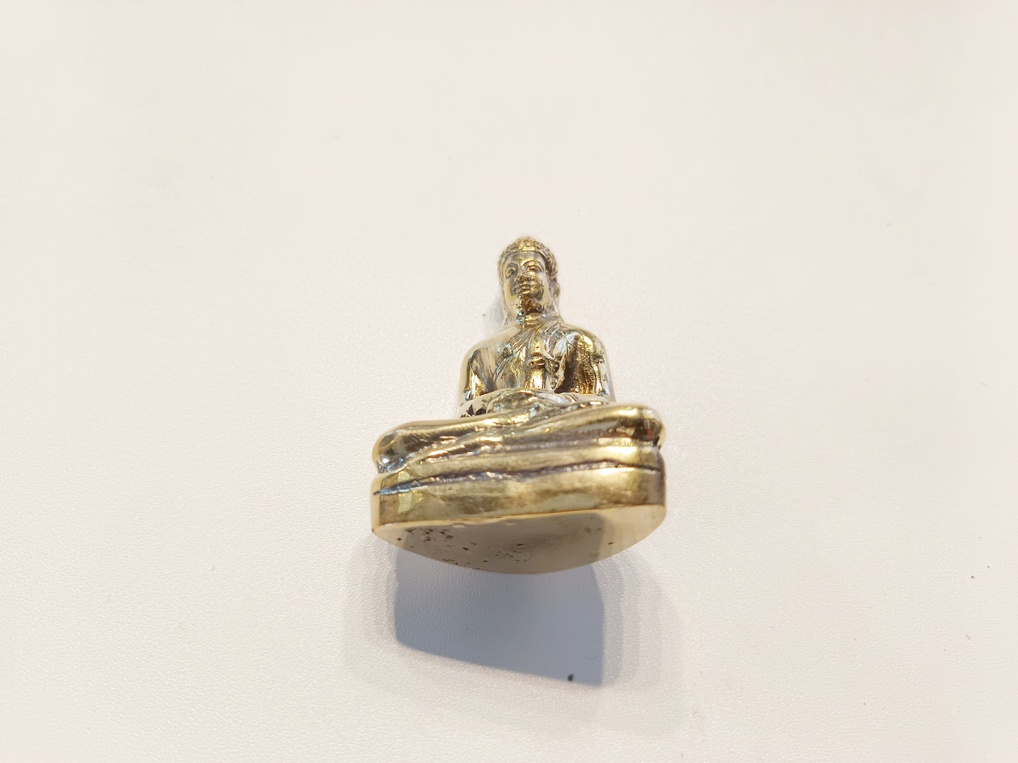 Meditating Buddha brass figurine, antique brass praying Buddha miniature.