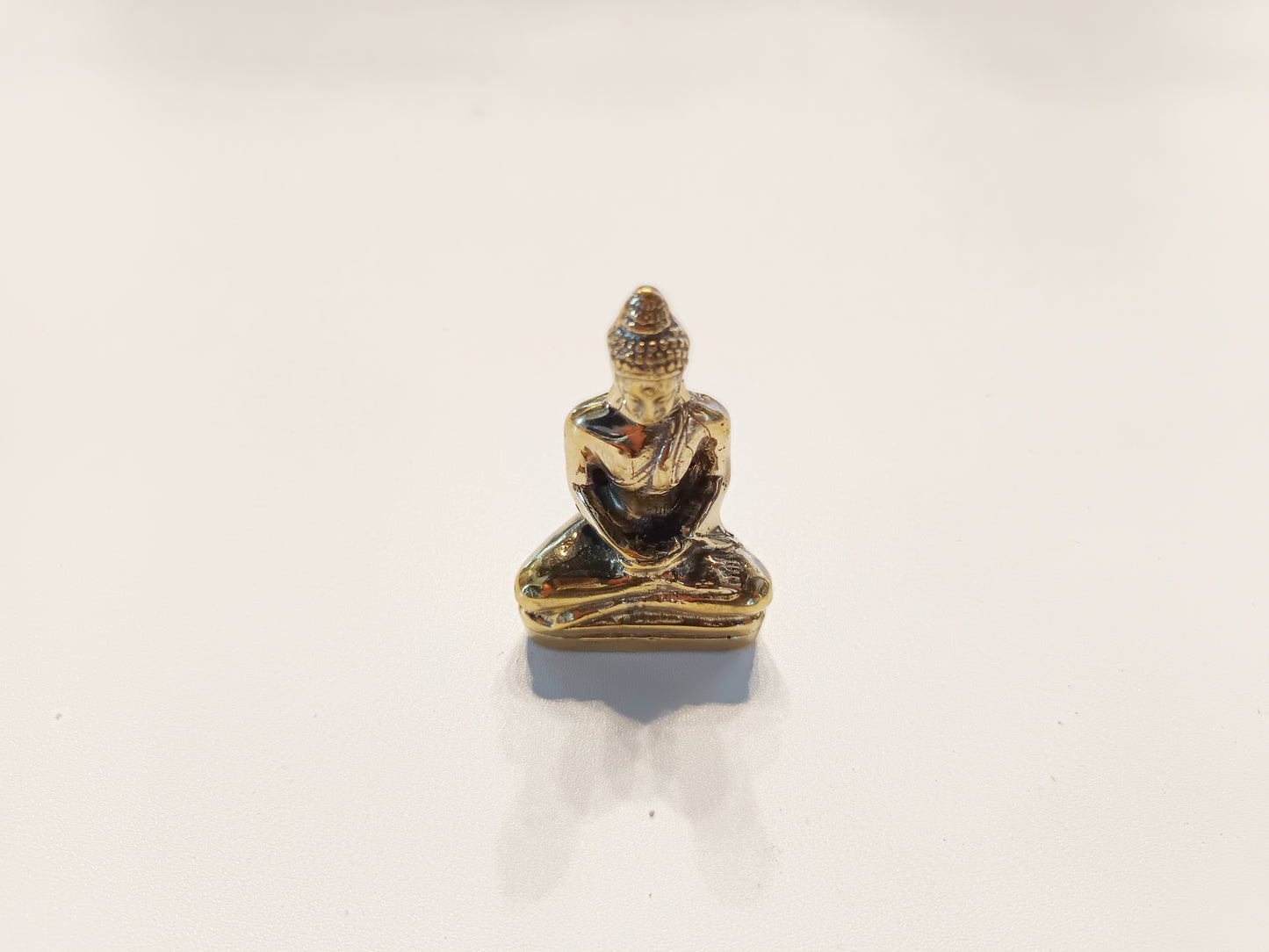 Meditating Buddha brass figurine, antique brass praying Buddha miniature.